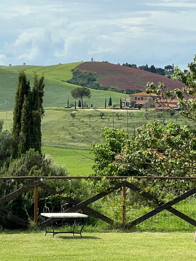 Rolling Tuscany hills from villa grounds