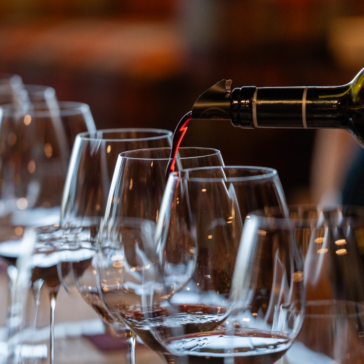 Red wine poured at a tasting